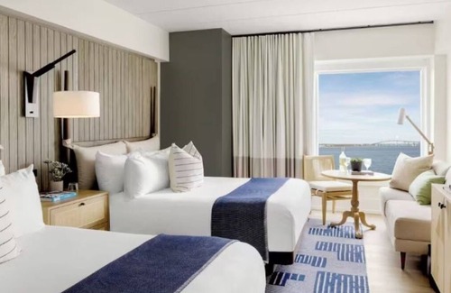 Goat Island Hotel | Tranquil Newport Getaway: Four Serene Waterview Rooms | Pets are Allowed