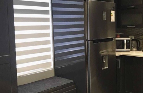 Downtown Apartment | Tranquility Hotel Suite RF, walking distance to the QPS, Ariapita Ave, & EV Zoo,