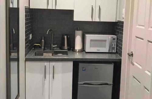 Downtown Apartment | Tranquility Hotel Suite RF, walking distance to the QPS, Ariapita Ave, & EV Zoo,