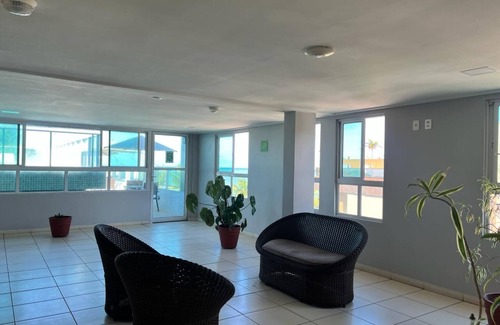 Cabo Branco Hotel | Triple suite with side sea view