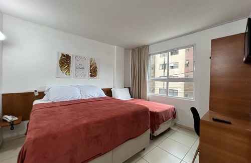 Cabo Branco Hotel | Triple suite with side sea view