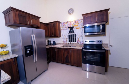 Falmouth House | Tropical Escape, Spacious 2 Bedroom Vacation Oasis with WiFi, AC