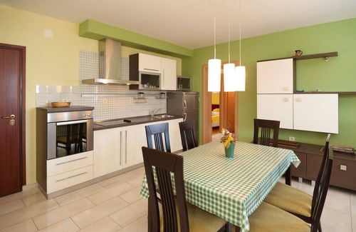 Postira Apartment | Two bedroom apartment with balcony and sea view Postira, Brač (A-15242-b)