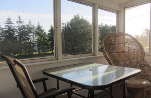 Morell Cottage | Two Bedroom Cottage With Open Concept Leading To Large Patio And Screened Porch.