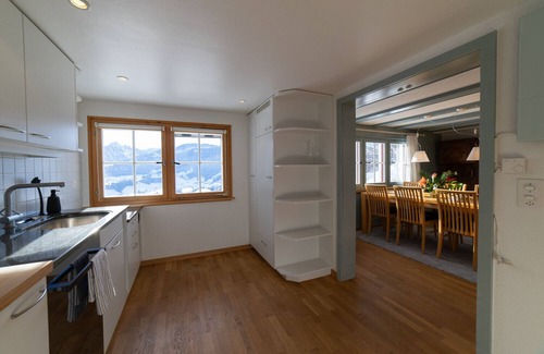 Ennetbuhl Ski Chalet | Undereggli - 4-room holiday home with far-reaching views and surrounded by greenery