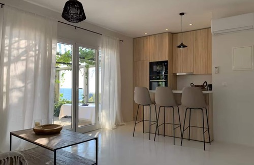 Agios Matthaios Villa | Unique view/Seaside/absolute privacy 2 bedrooms villa among the olive groves.