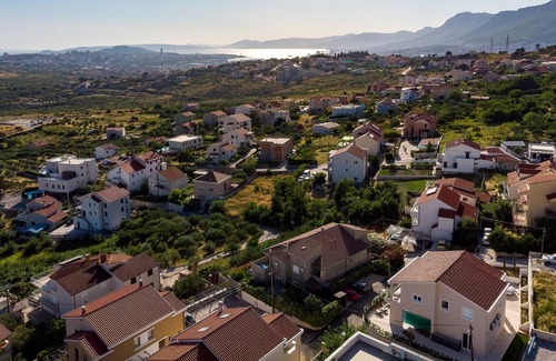 Mravince House | Vacation home with heated pool with covered terrace, stylish interior.