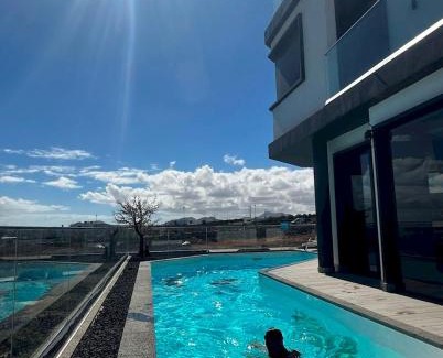 Corralejo Villa | Villa Poseidon Corralejo with Private Heated Pool, Sauna and Stunning Volcano Views by Amazzzing Travel