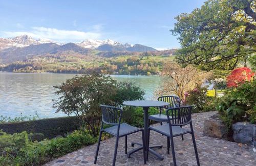 Faulensee Apartment | Villa with pool, garden & direct at lake