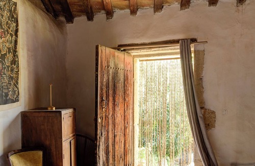 Meynes House | Village house in its original state (under the bell tower)