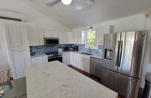 Discovery Bay Villa | Waterfront 3BR Villa w/Pool, Parking & Private Patio