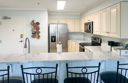 Fort Morgan Condo | Waterfront condo w/balcony, boat slip, shared hot tubs, pools