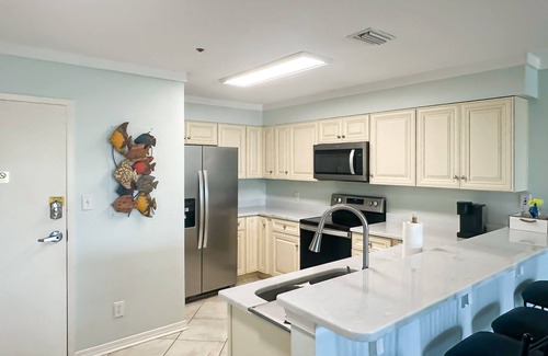 Fort Morgan Condo | Waterfront condo w/balcony, boat slip, shared hot tubs, pools