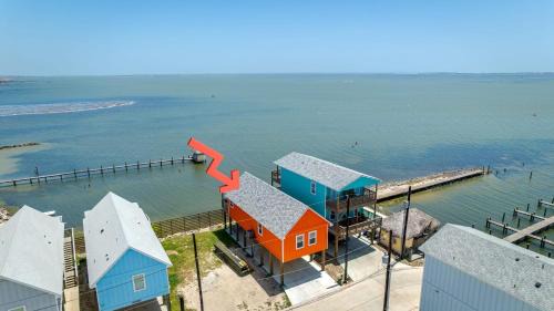 Flour Bluff House | Waterfront Escape w Views Shared Pool Boat Dock Orange Crush by AvantStay
