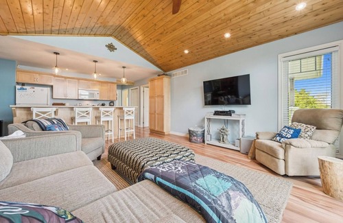 Miller Lake Cottage | Watersedge: 4BR Miller Lake cottage with dock, firepit, decks, spacious interiors, rec room & foosball.