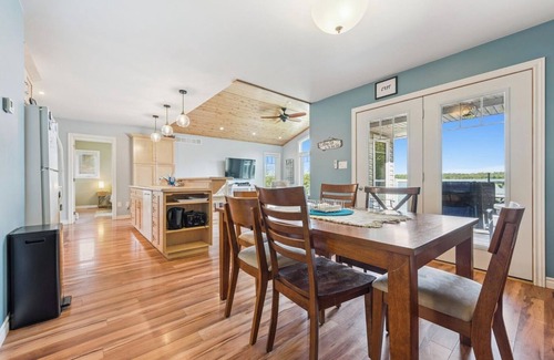 Miller Lake Cottage | Watersedge: 4BR Miller Lake cottage with dock, firepit, decks, spacious interiors, rec room & foosball.