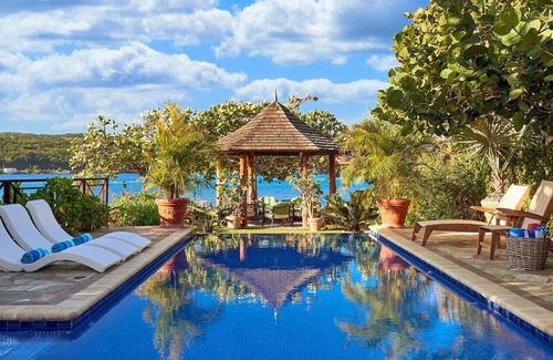 Discovery Bay Villa | Whispering Waters Villa- Exclusive Beachfront Retreat. Pool, & Spacious Terraces