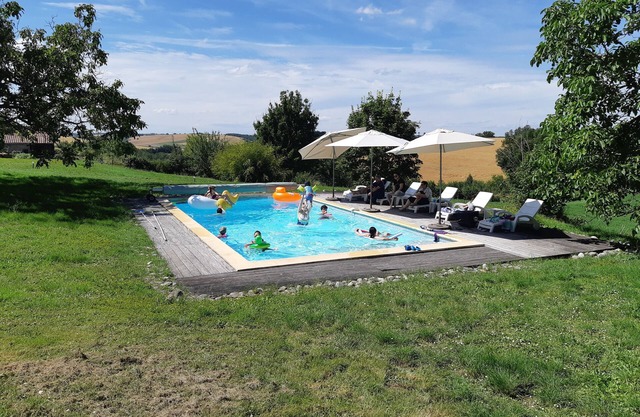 10-person self-catering cottage with heated pool, extra beds available.