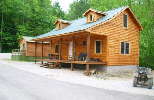 3BR, 1 Bath Cabin with hot tub, full kitchen, and living room.