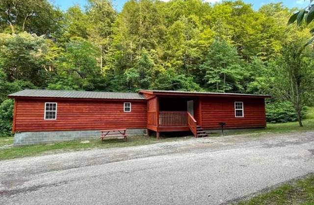 3BR, 2 Bath Cabin with full kitchen, living room, and hot tub.