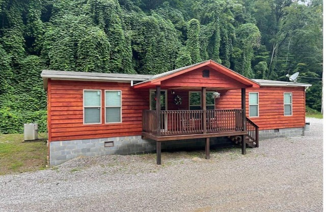 3BR, 2 Bath house with full kitchen, living room, and hot tub.