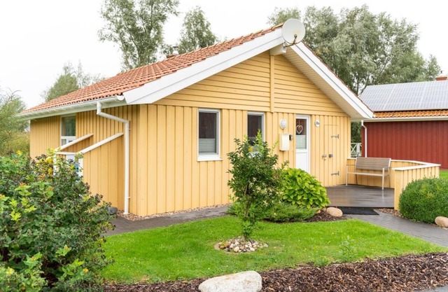4 person vacation home with sauna, wood-burning stove and a beautiful garden with terrace in Otterndorf