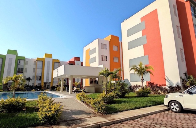 8 minutes from the beach! Family apartment with pool & gardens in private gated community