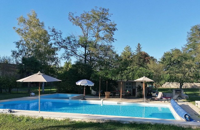 A stone lodge set in the grounds of an old farmhouse in the Charente countryside