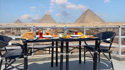 AL NABELLA SCARAB pyramids view
