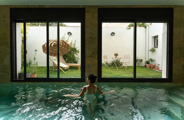 Apartment with heated pool and garden.