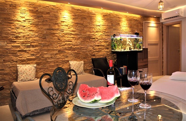 Aquarial Home is new built, spacious , with stone wall and aquarium.