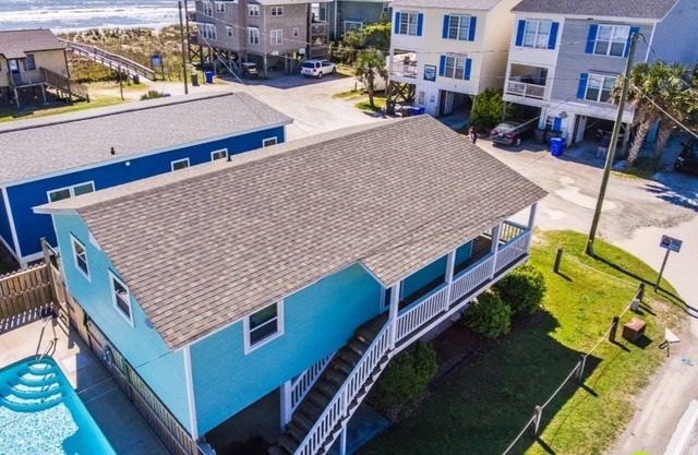 Beach view home in walking distance to public beach access & with private pool.