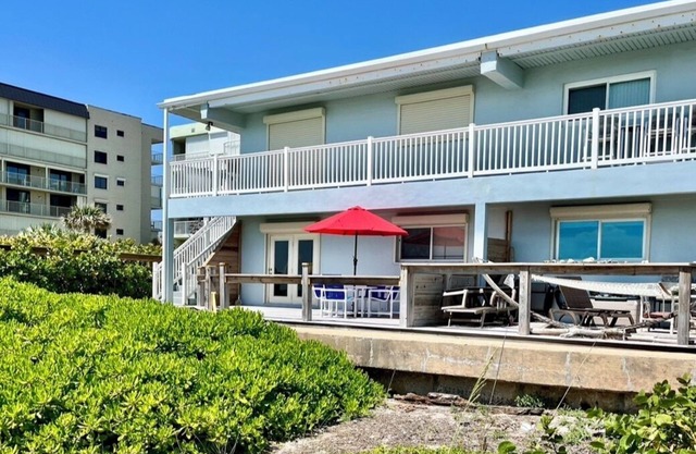 Beachfront ground floor condo with deck and heated pooln