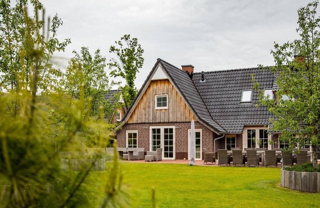Beautiful house with a fireplace surrounded by nature