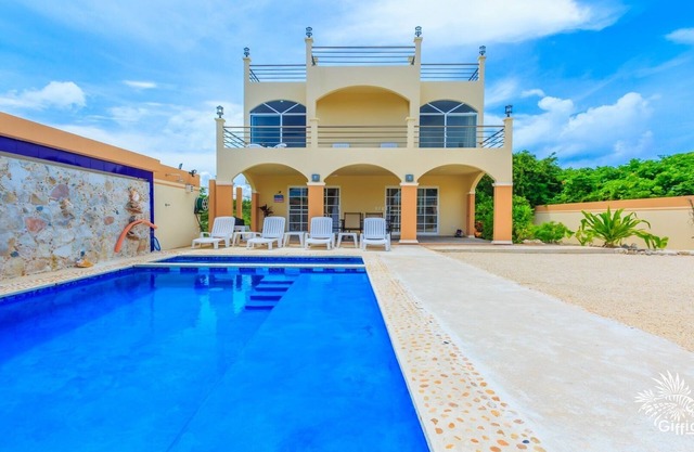 Beautiful private gated 2 bedroom home with pool, terraces and ample parking.