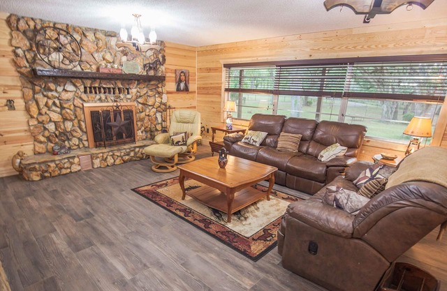 BEAUTIFUL RETREAT HOME ON 2 FENCED PRIVATE ACRES. WALK TO FOREST AND GOLF!