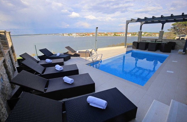 Brand new amazing sea front villa with pool for up to 10 people