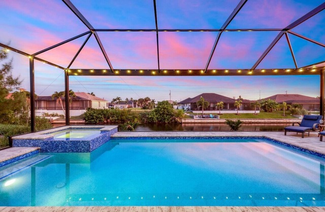 BRAND NEW- Gulf access electric heated pool home sleeps up to 13 guests