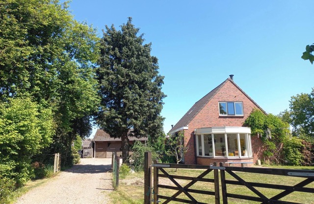 Bright and comfortable house, large fenced yard, toys, hiking, wood stove!