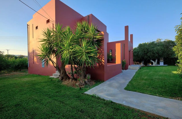 Bright villa surrounded by orange trees