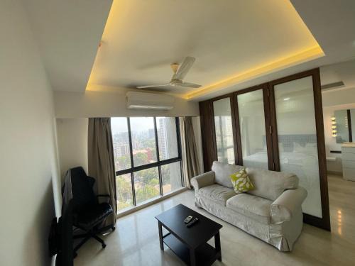 Business-Ready Apt near Jio World Centre 1BR Gym Pool WiFi