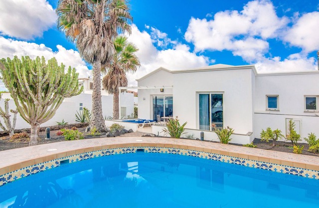 C3, in a small complex with communal heated pool 100m from the sea