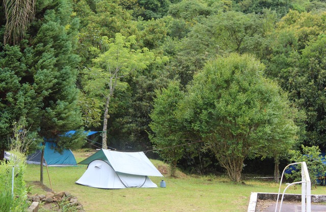 Camping area with waterfall and small beach in the Serra da Mantiqueira in Munhoz-MG
