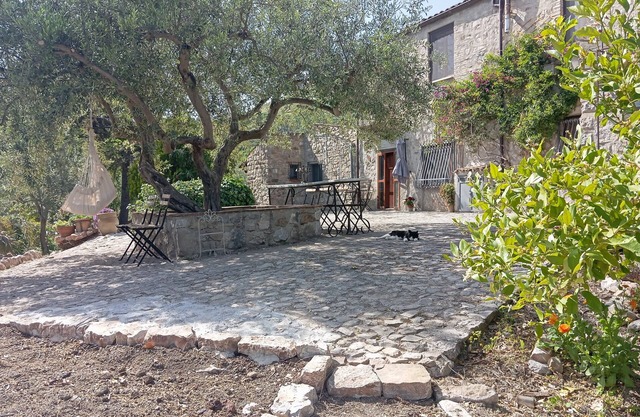 Casa del Vento in San Cono, ancient stone dwelling among olive trees