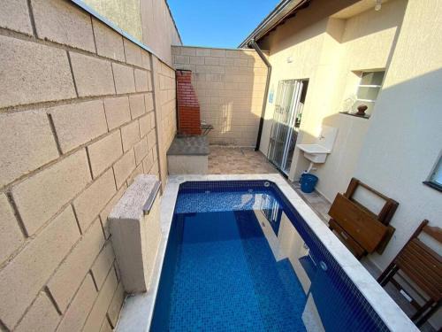 Casa em condomínio piscina privativa churrasqueira