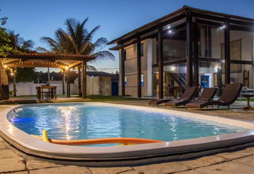 Casarão de vidro - Pé na Areia - Praia Enseada dos Corais