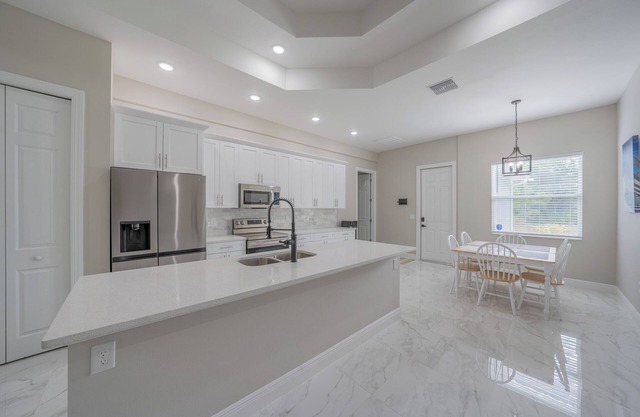 Charming 4-bedroom New Construction farmhouse in pleasant Lehigh Acres