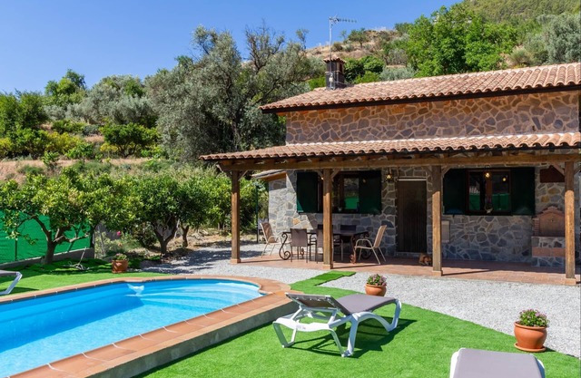 Charming farmhouse among orange trees