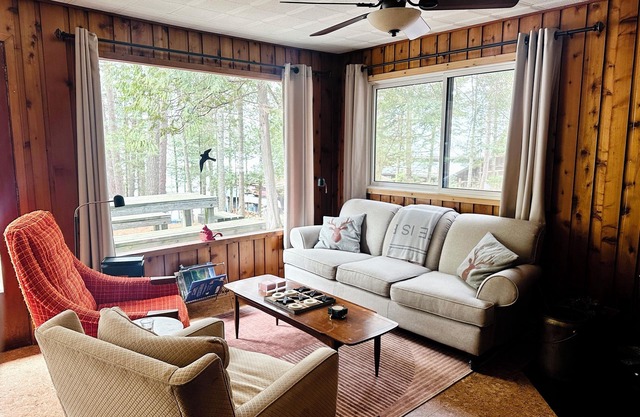 Charming lakefront cottage with private dock, stunning sunsets & cozy wood stove