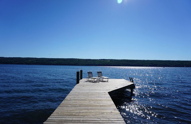 Charming lakefront cottage with private beach and boat dock.